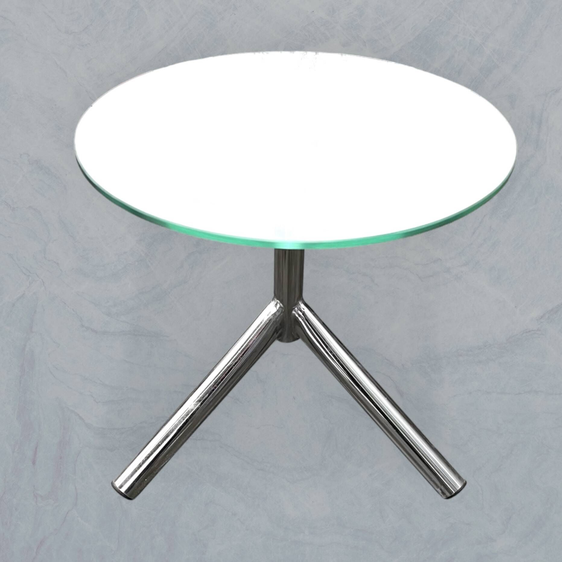 Modernist tripod side table in tempered glass and chrome metal.