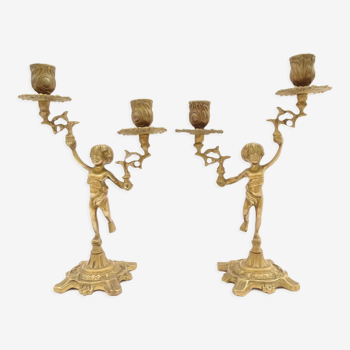 Pair of bronze cherub candlesticks.