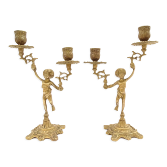 Pair of bronze cherub candlesticks.