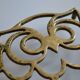Vintage openwork brass trivet in the shape of an owl or owl