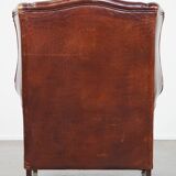 English style sheepskin leather wingback chair in a cognac color