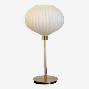 Table lamp with a white striped globe, origami style and a golden foot