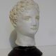 Ancient bust in Roman Greco patinated plaster.