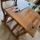 Old school desk with integrated adjustable seat.