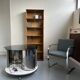 Vintage metal and smoked glass coffee table on casters bar
