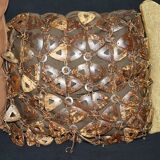 Vintage 1970s canapé with bamboo frame and Aztec patterns.