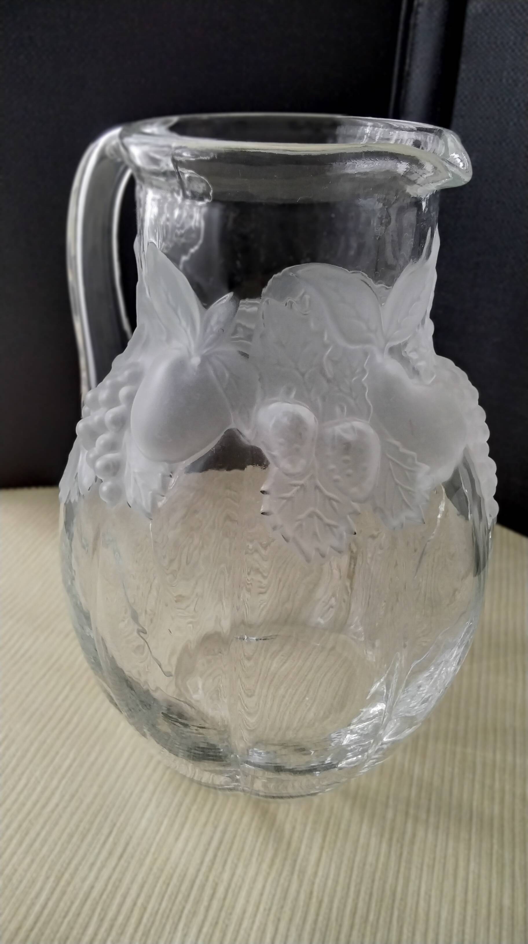 Large water jug with embossed fruit decoration in frosted glass