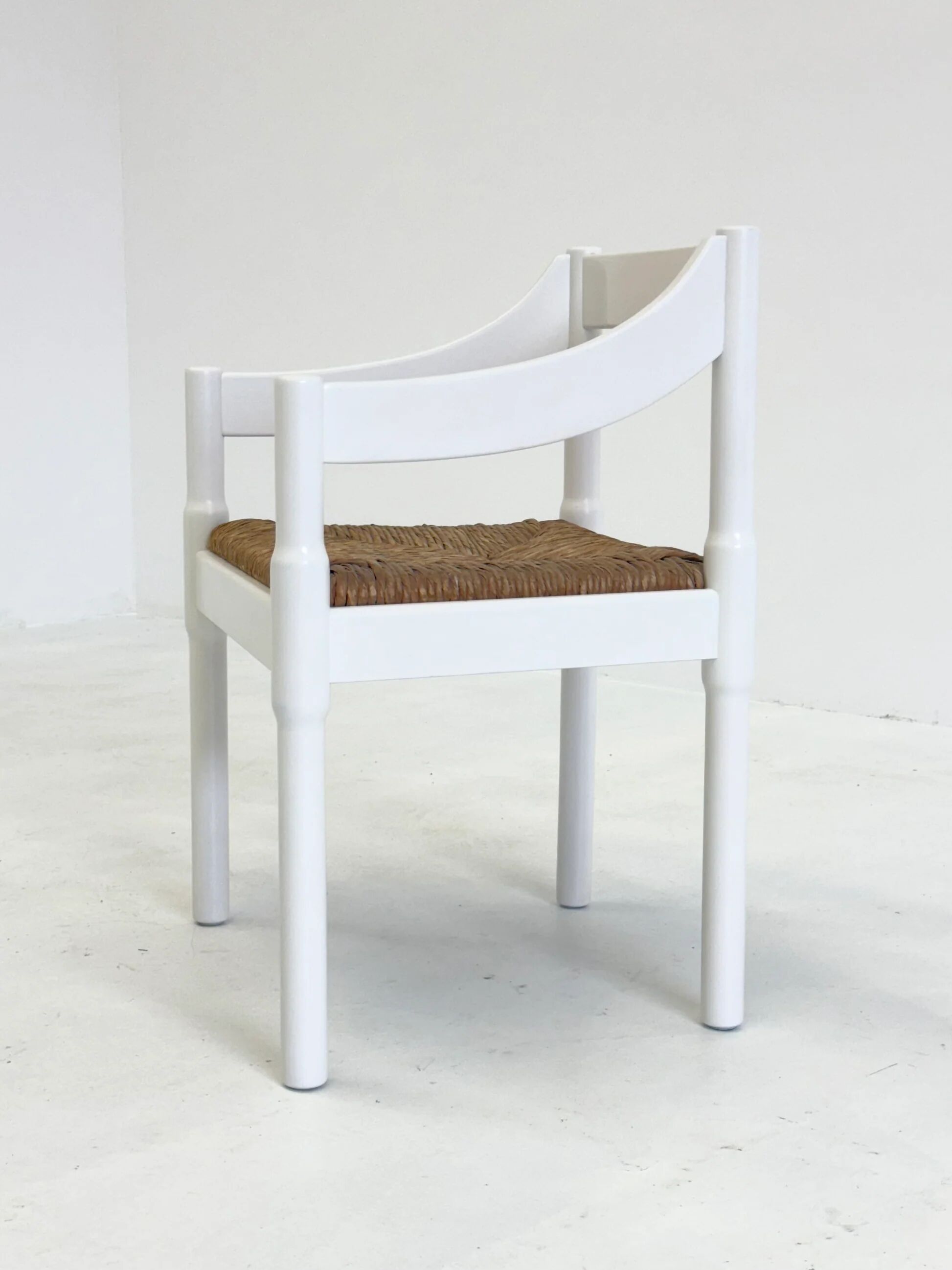Set of two Carimate chairs by Vico Magistretti in white