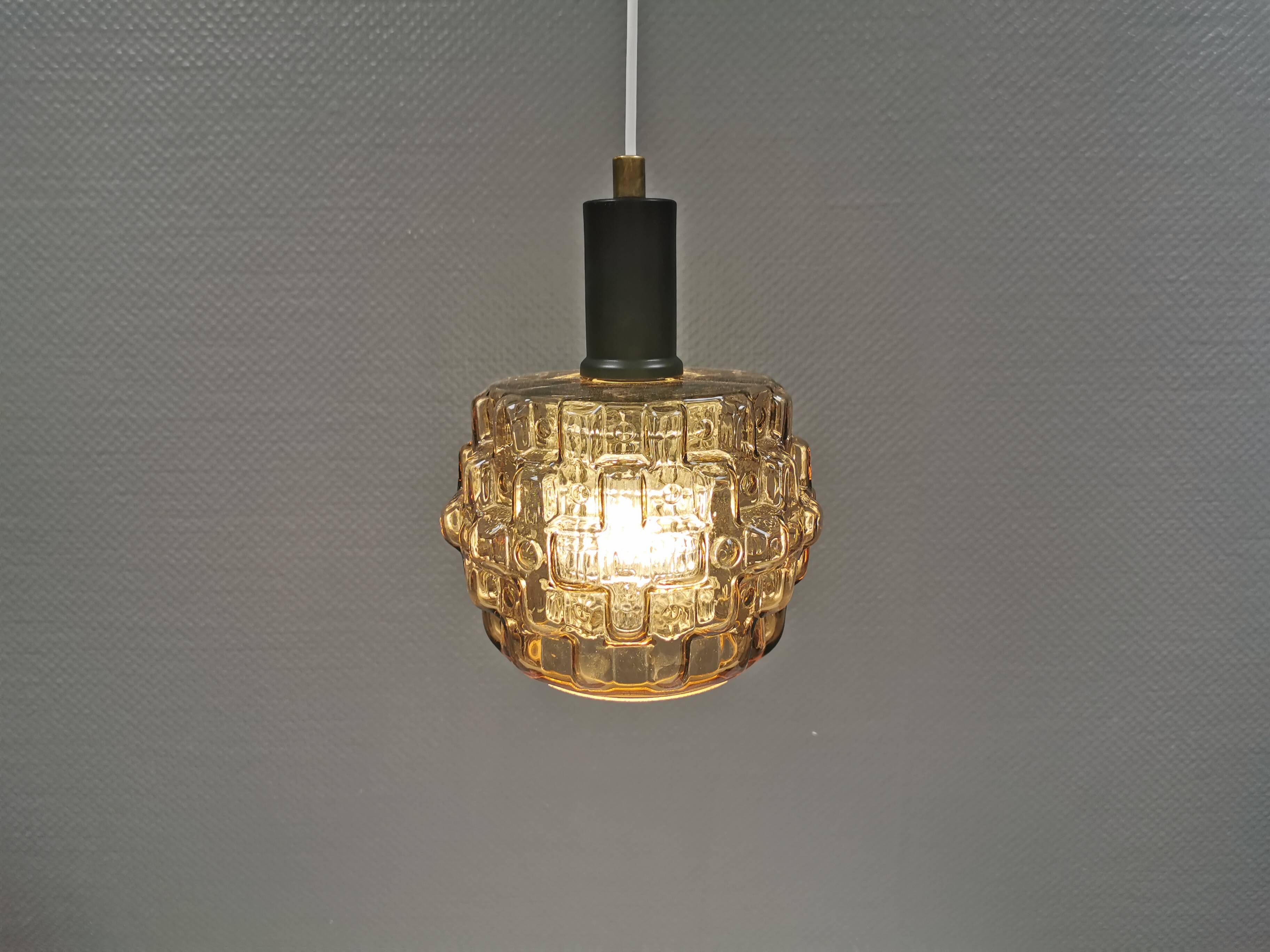 Older hanging lamp with champagne colored outer glass with inner shade of crystal glass.