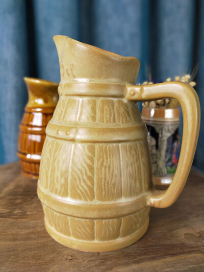 Two pitchers and a small original king beer mug