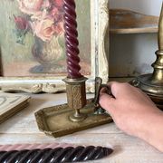 Antique brass thumb candle holder