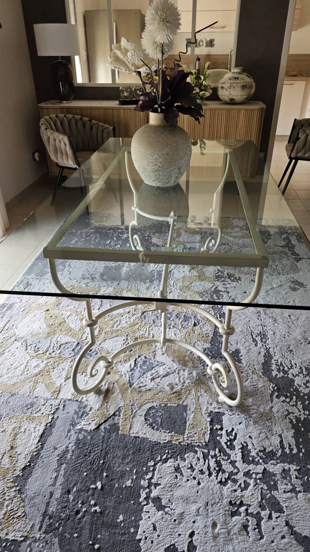 Wrought iron table by Roche Bobois, with a glass top.