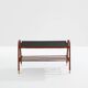 Jacques Adnet coffee table in red saddle-stitched leather and brass, 1950s