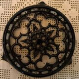 Vintage enameled cast iron trivet