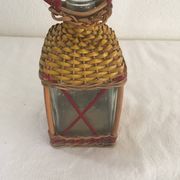 Bottle sheathed on the top and the low d wicker woven