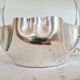 Antique silver sugar bowl with sprinkling spoon