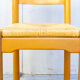 Quatre tabourets en bois et en paille 70s
