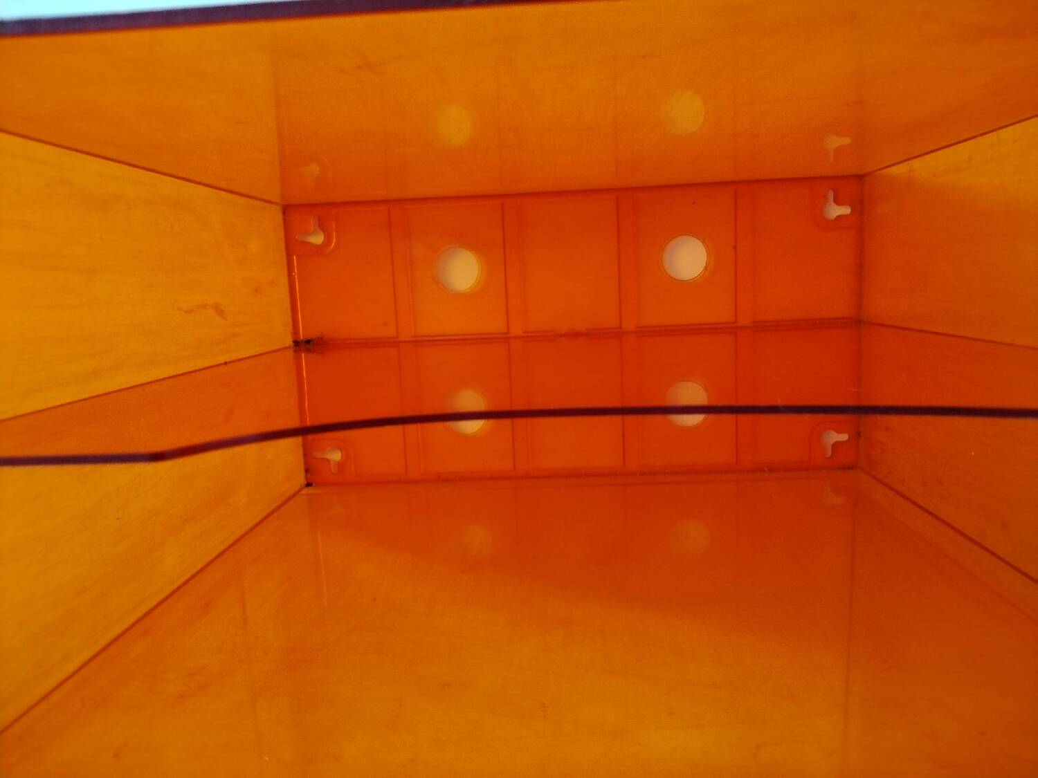 Vinyl magazine holder in orange plexiglass