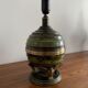 Art Deco table lamp in patinated bronze with eagles holding a globe, France 1940.