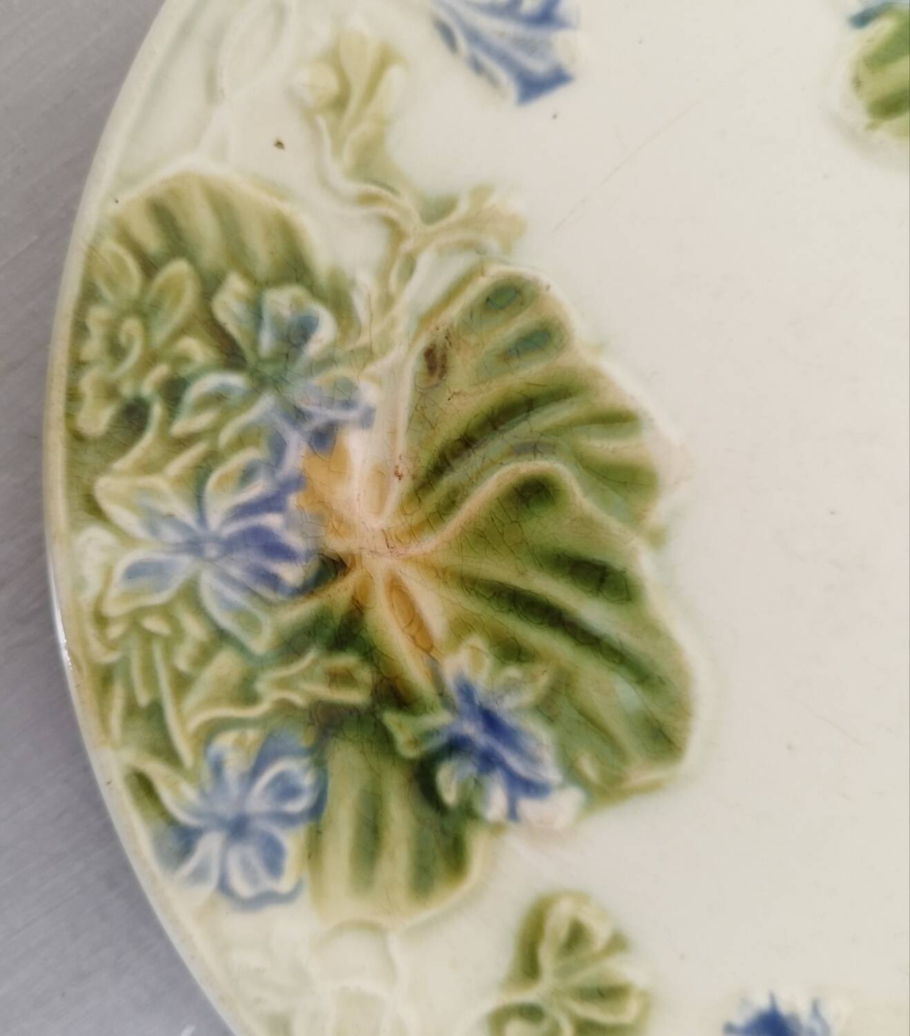 Antique Barbotine Plate Floral Decor and Green Foliage