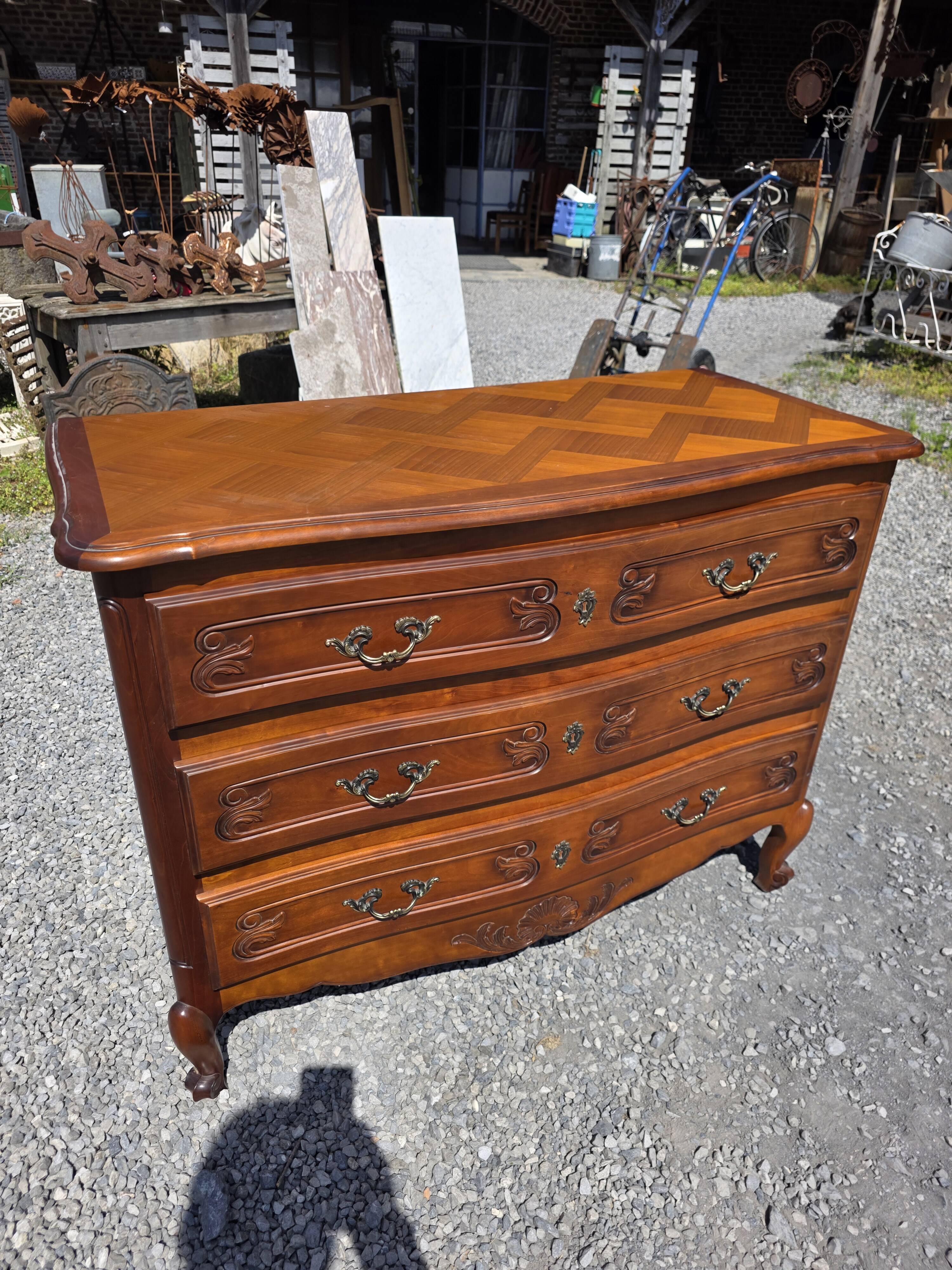 Curved commode in Louis XV style made of cherry wood.