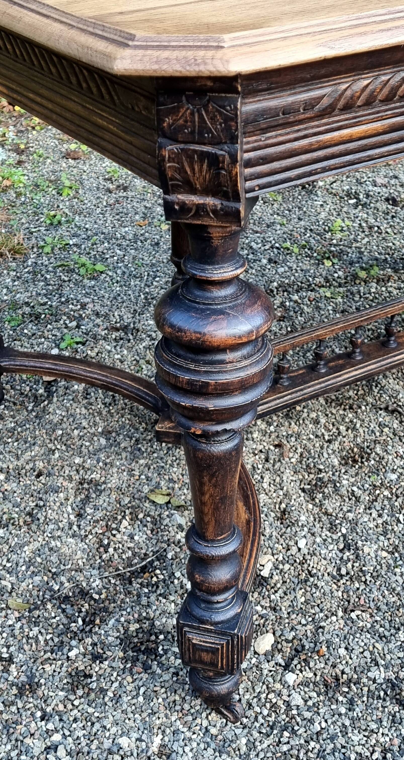 Table from the late 19th century, neo-Renaissance style, in black and oak.