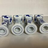 Four candlesticks with blue patterns