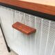 Mid-century teak side table with magazine rack.