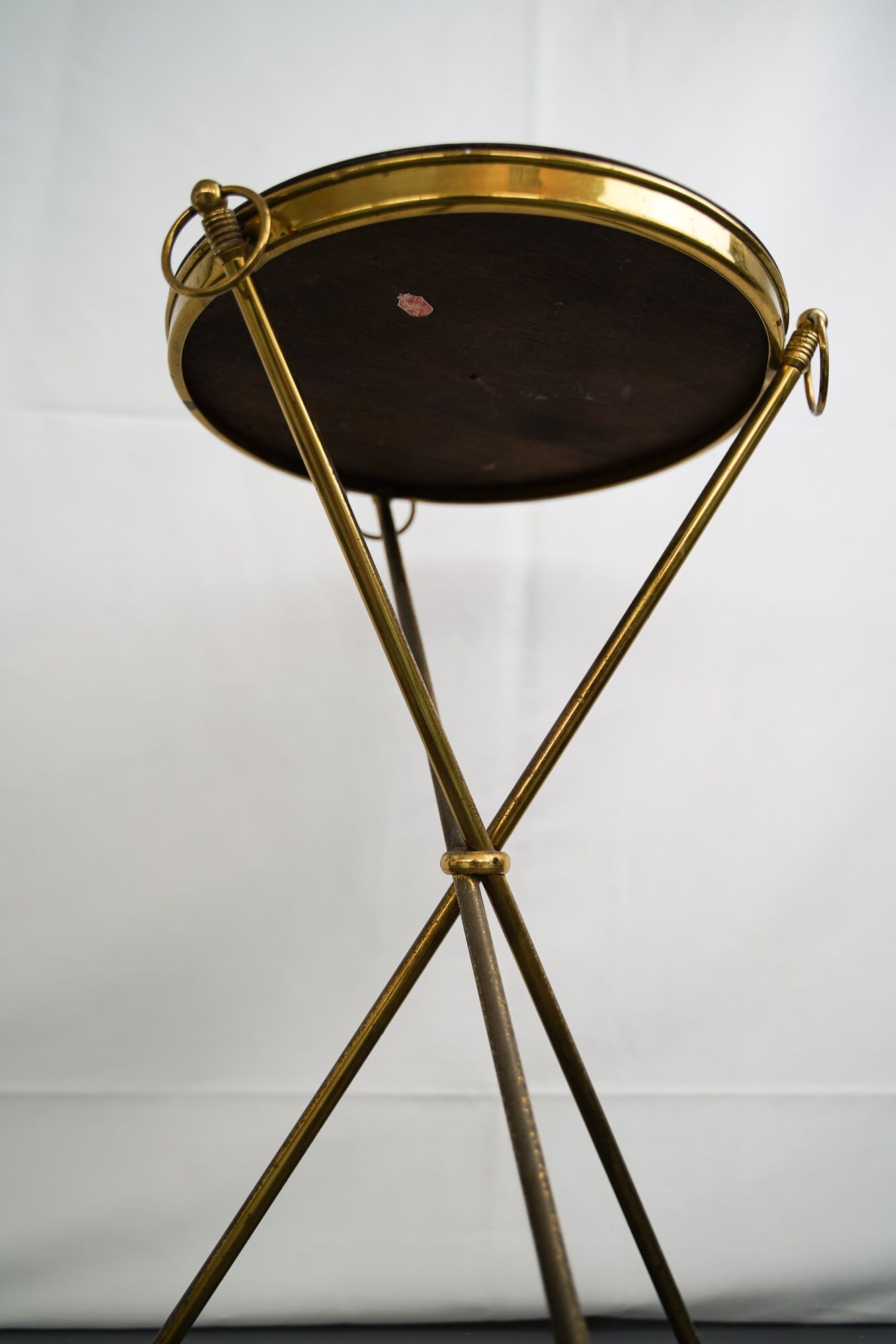 Small Italian brass and wood tripod coffee table from 50s
