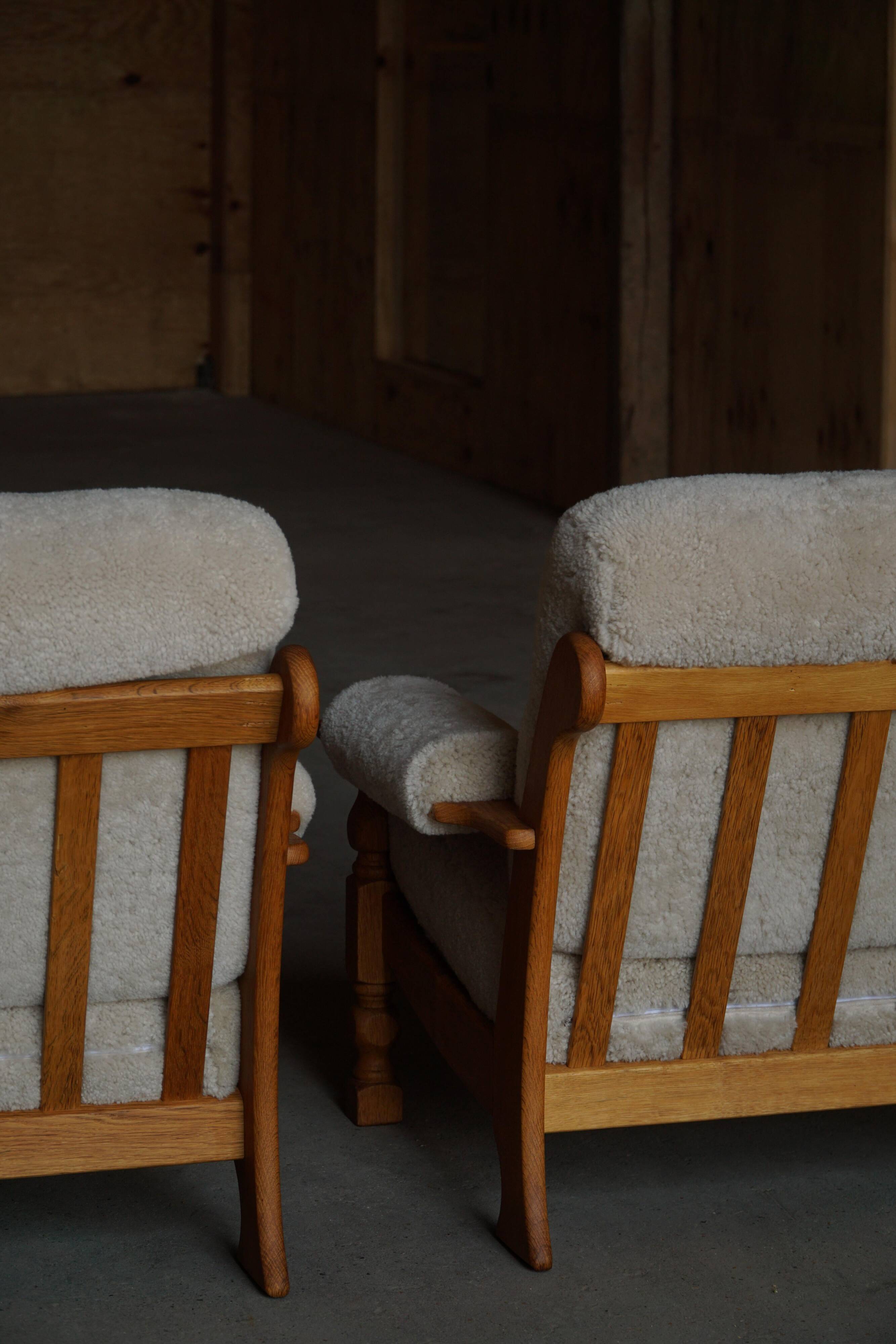 Henning Kjærnulf, lounge chairs in oak and lambswool, mid-century Danish, 1960s.