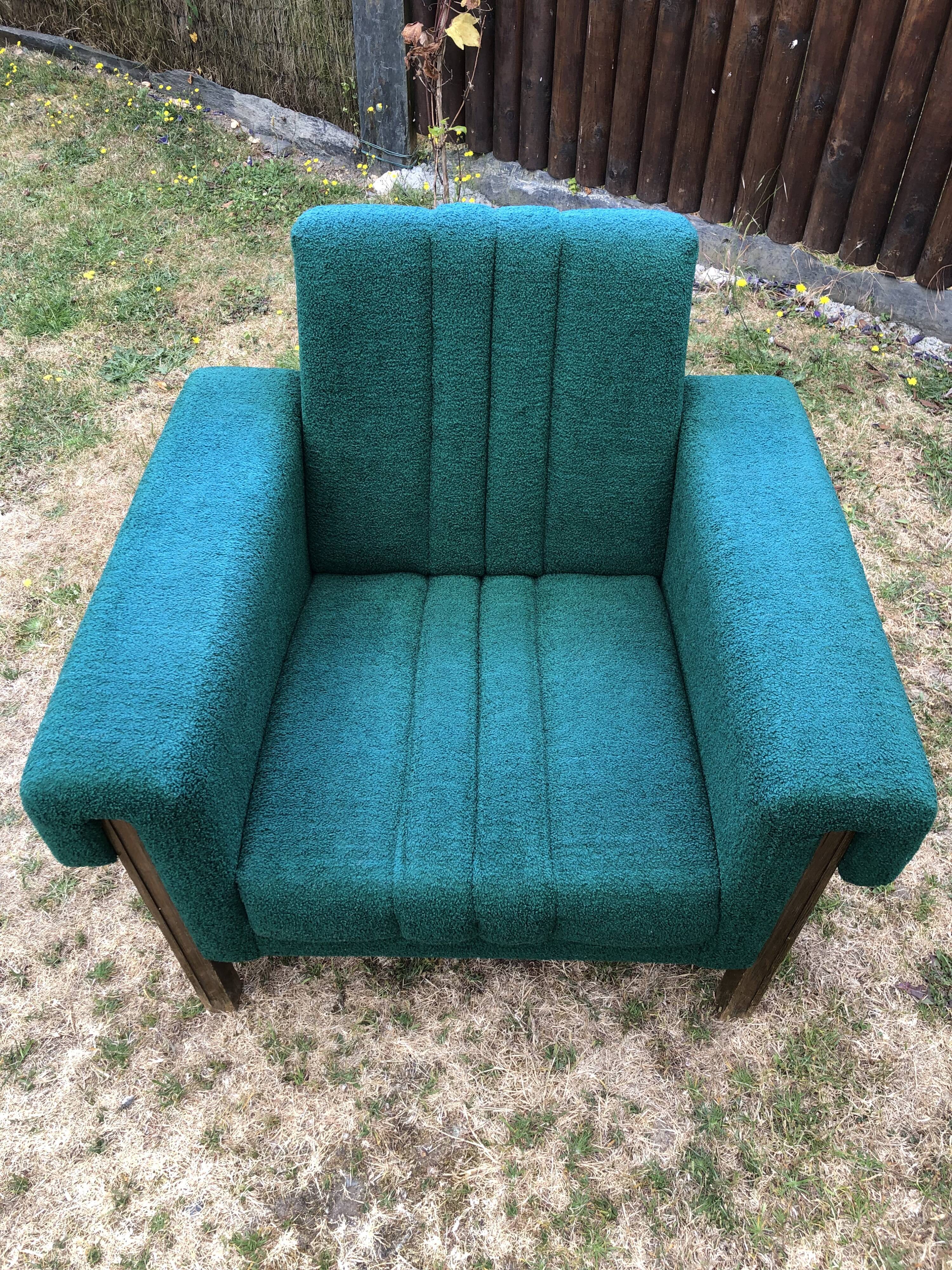 Duo of vintage armchairs with green fabrics.