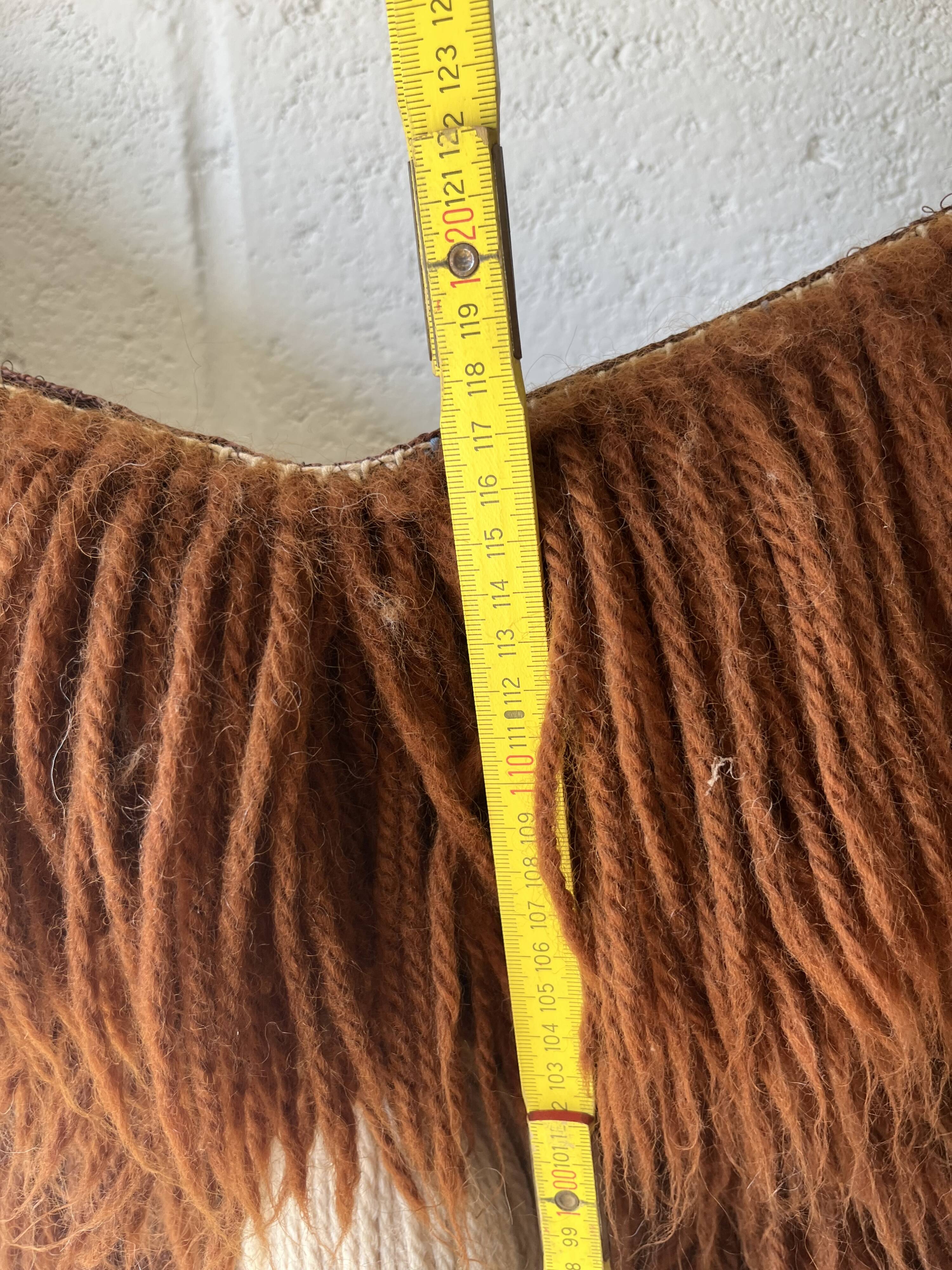 Handmade woven wool wall tapestry from the 70s and 80s, vintage macramé.