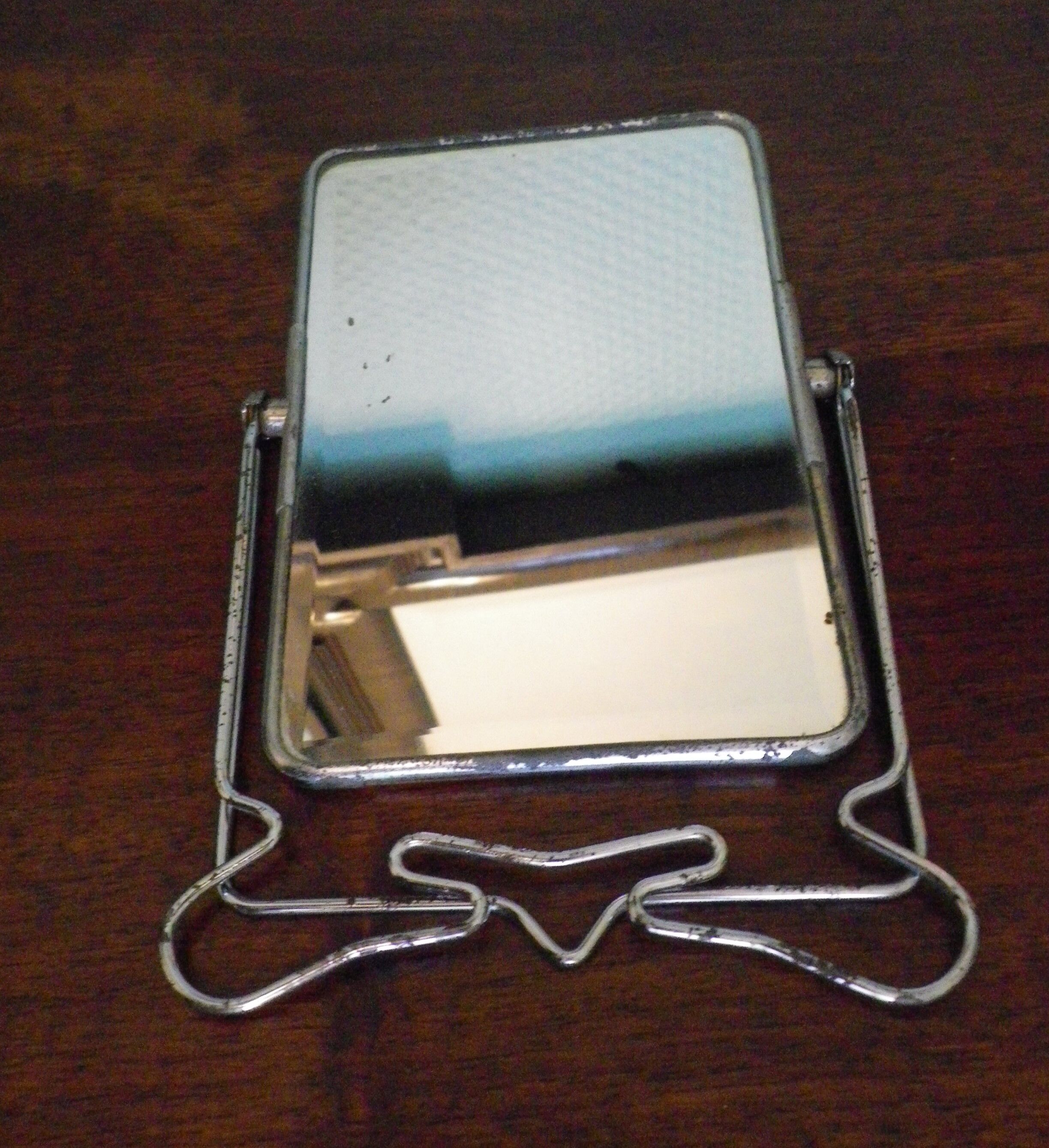 Two-foot barber mirror, suspension mode, beveled, chrome metal - 70s -
