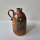 Ceramic handle soliflore vase with an unidentified signature