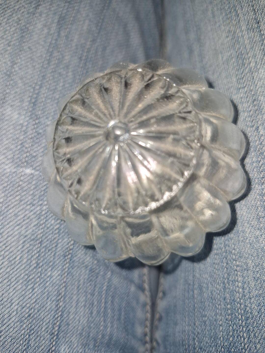 Antique cut glass spirit decanter with silver-plated neck and spout.