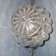 Antique cut glass spirit decanter with silver-plated neck and spout.