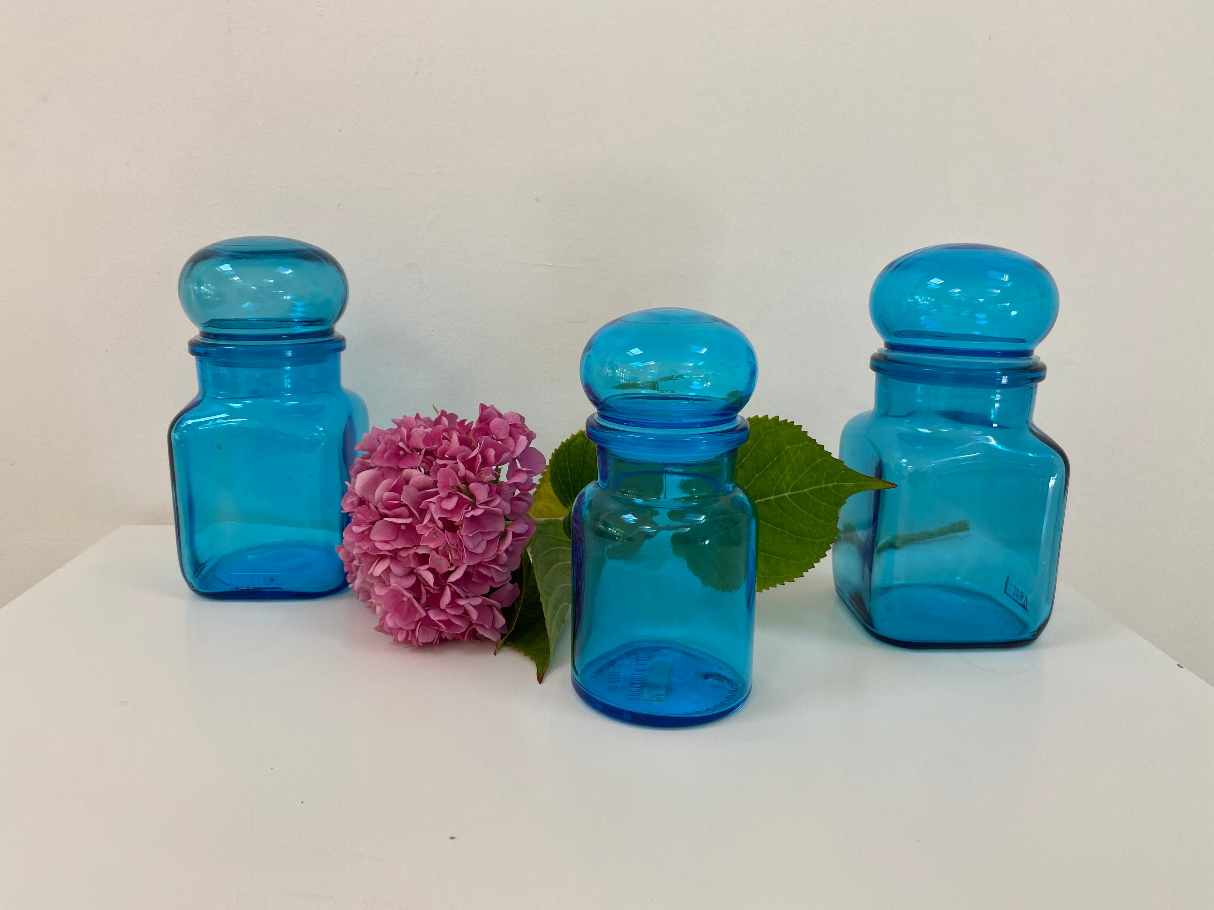 Trio of vintage turquoise blue glass jars