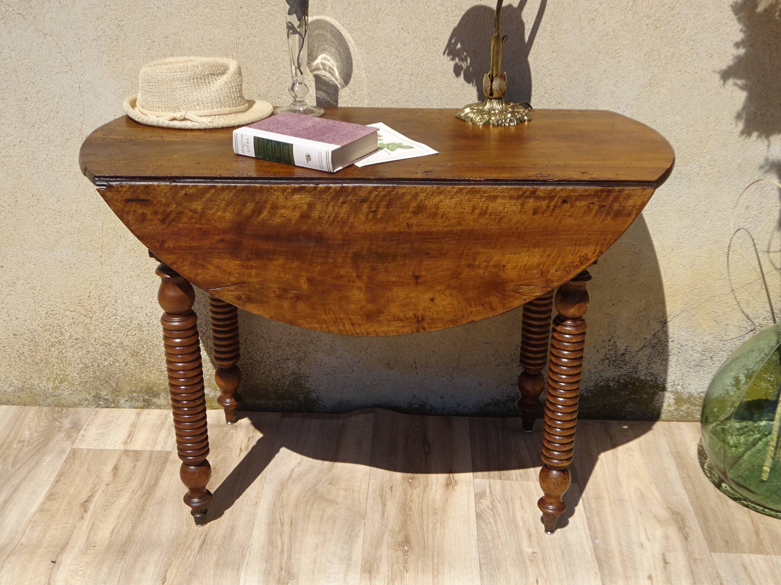 Antique walnut console table with honey spoon legs.