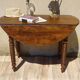 Antique walnut console table with honey spoon legs.