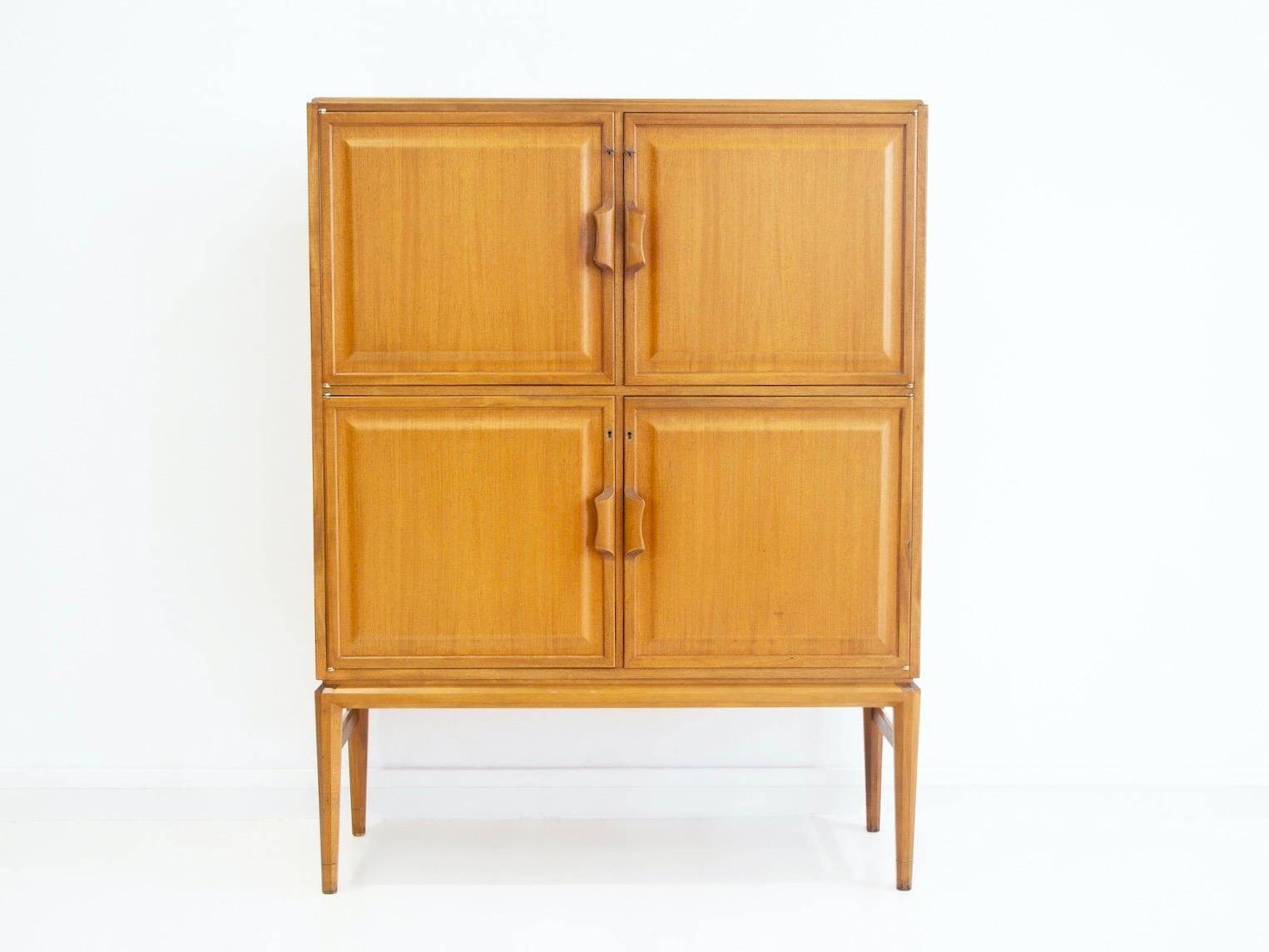 Large Swedish mahogany storage unit with four front doors.