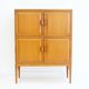 Large Swedish mahogany storage unit with four front doors.