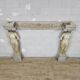 Neoclassical plaster fireplace with caryatids (nude women)
