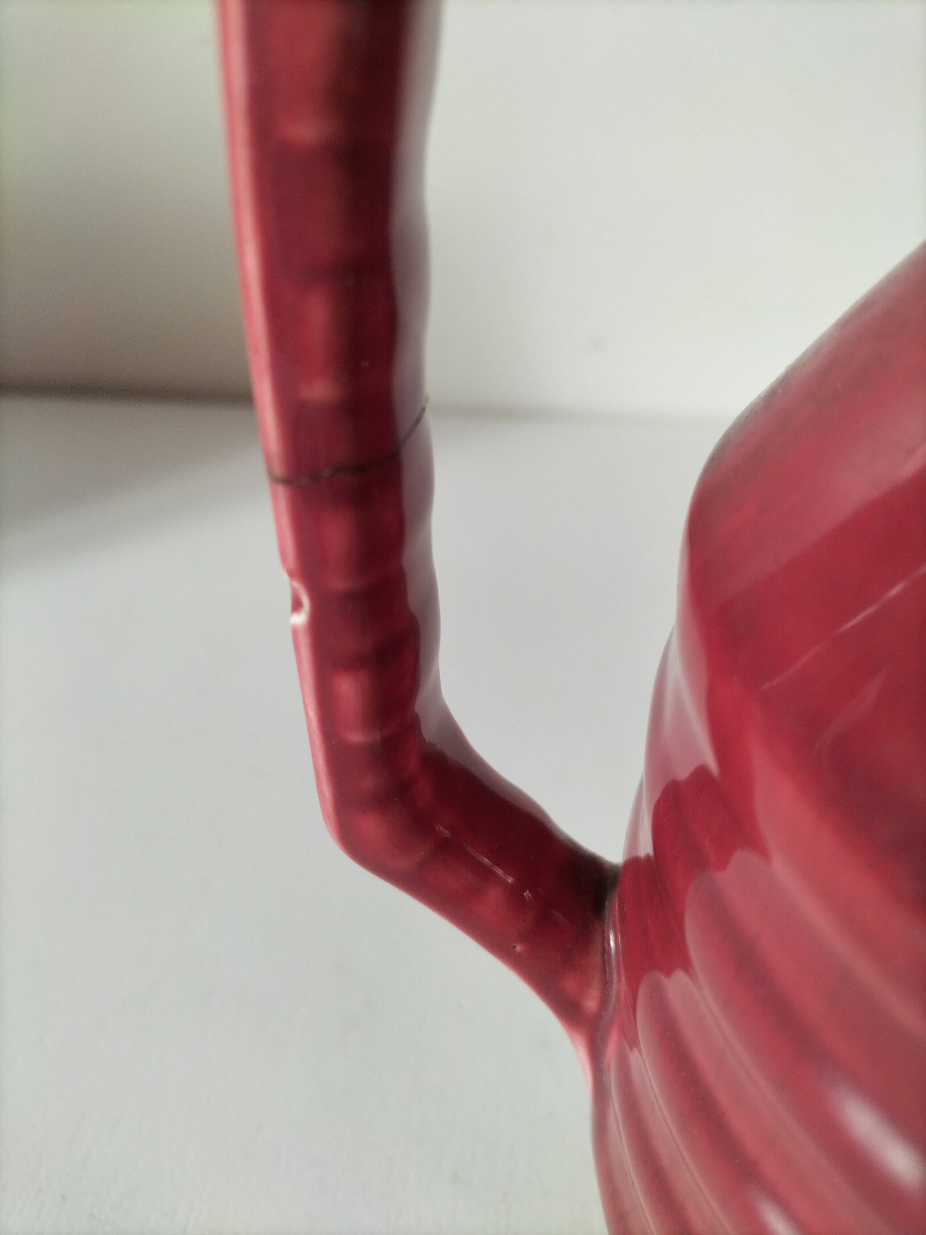 Old raspberry red pitcher from Onnaing, early 20th century.