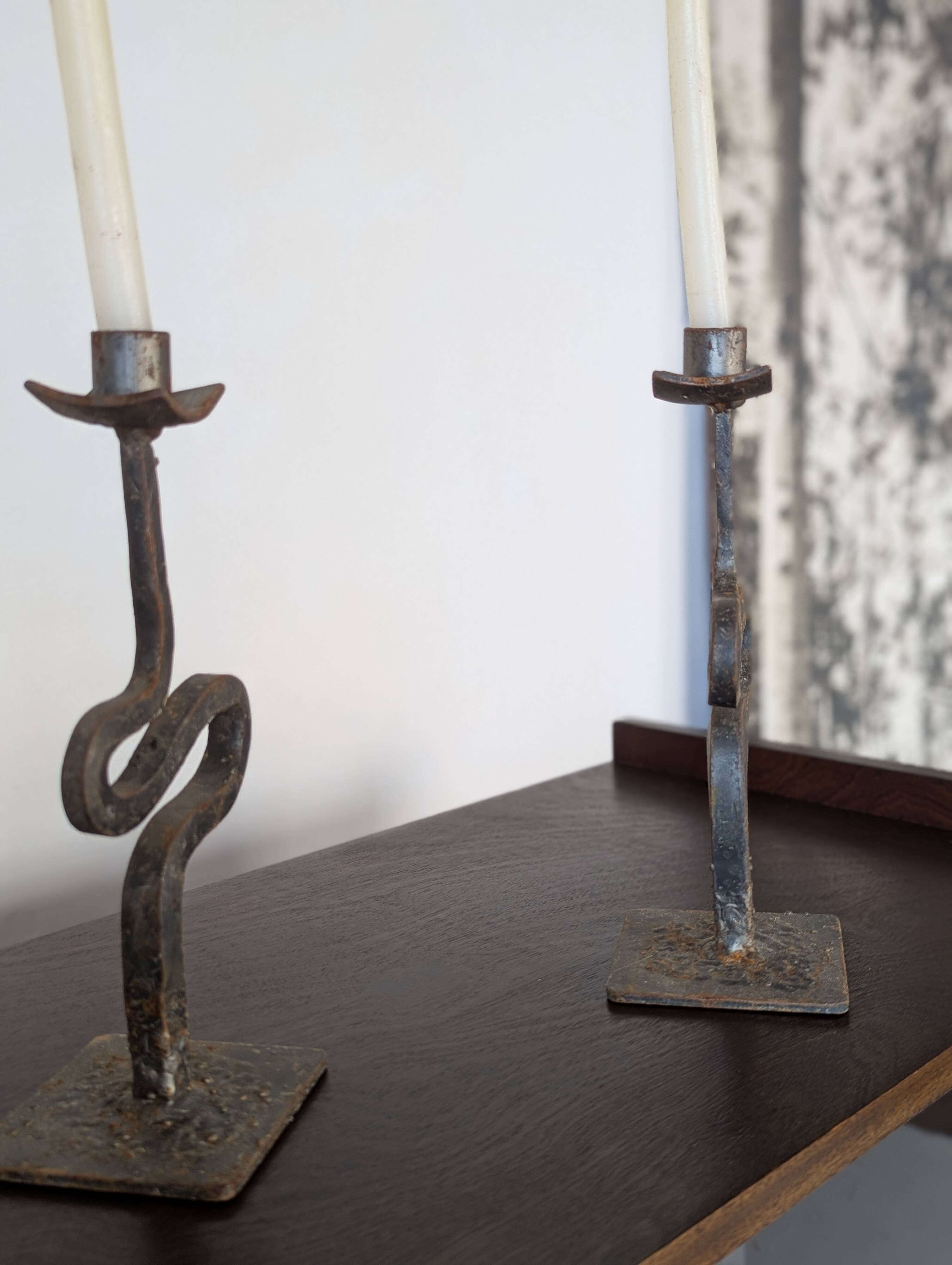 Pair of wrought iron candlesticks