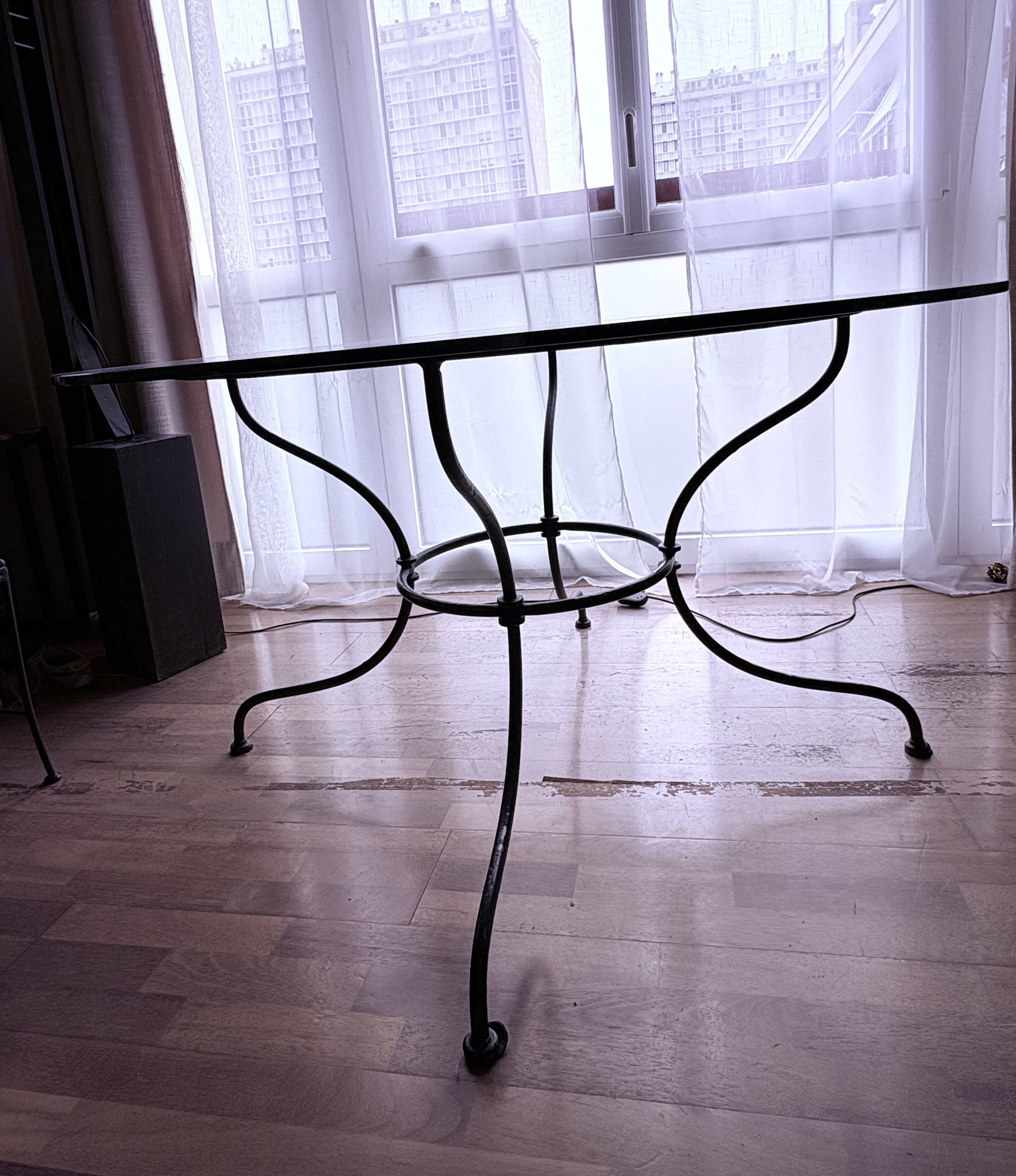 Round glass table - wrought iron base