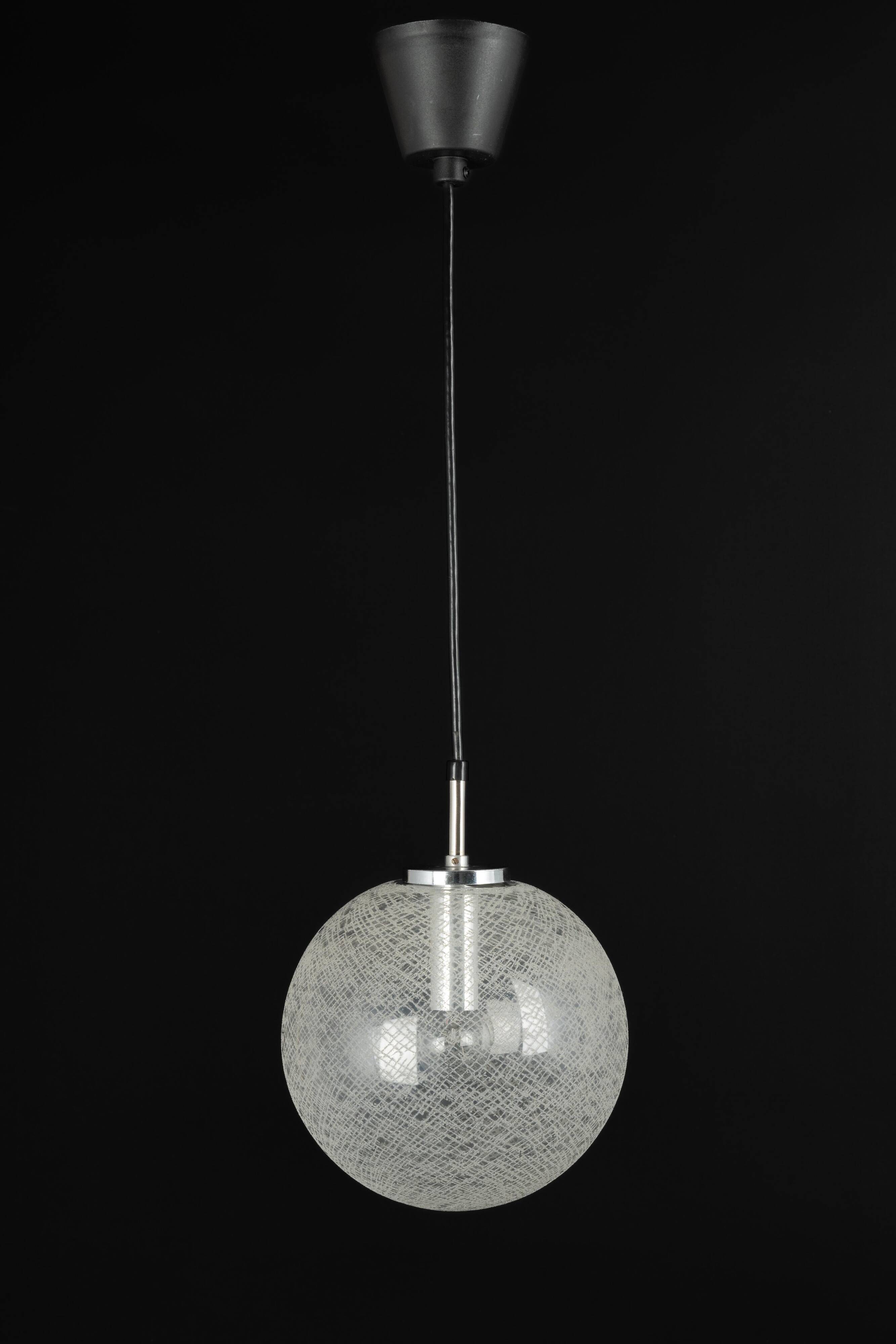 Small chrome Limburg pendant light with glass ball, Germany, 1970s.