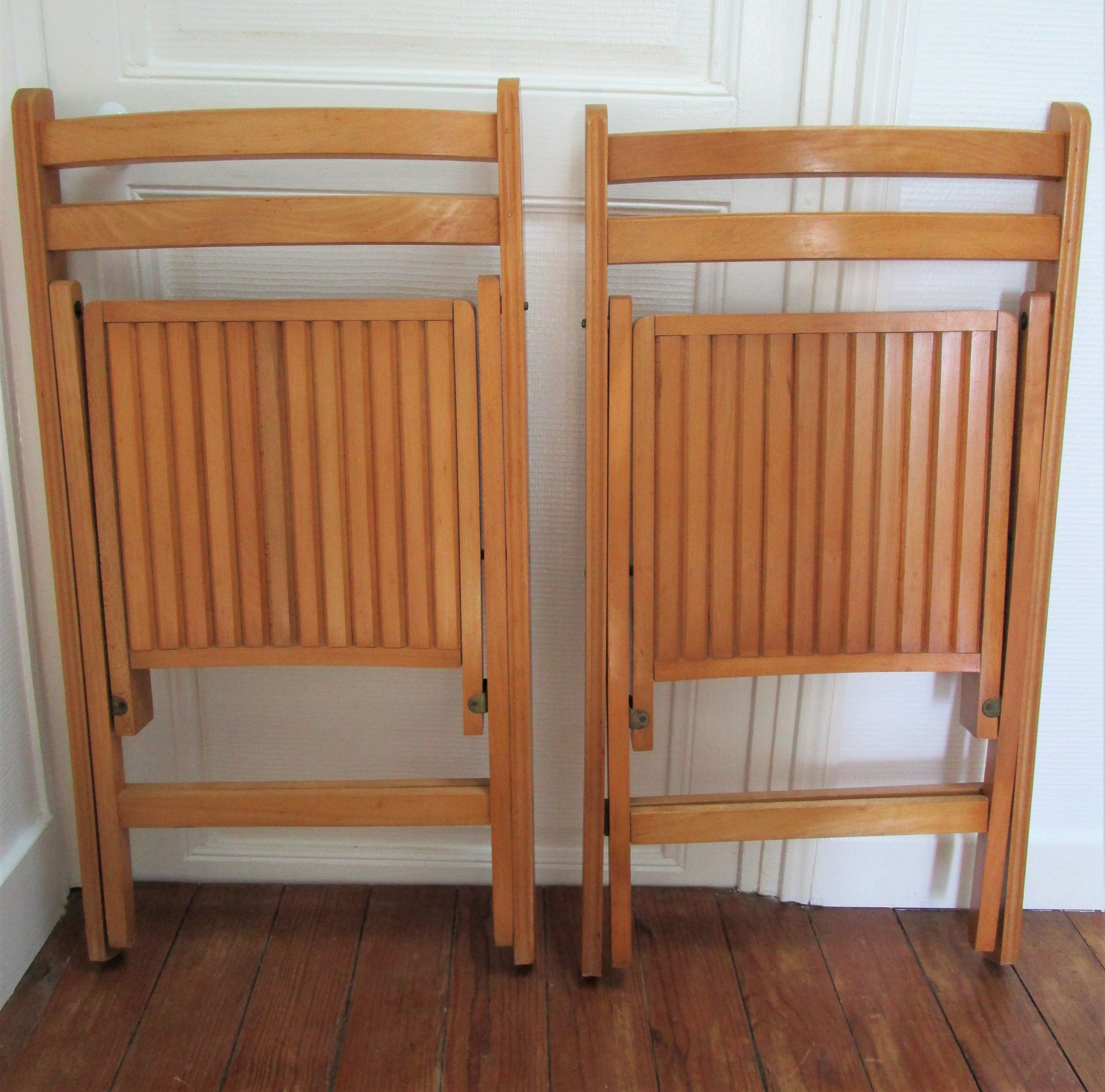 Pair of folding chairs with vintage solid wood slats