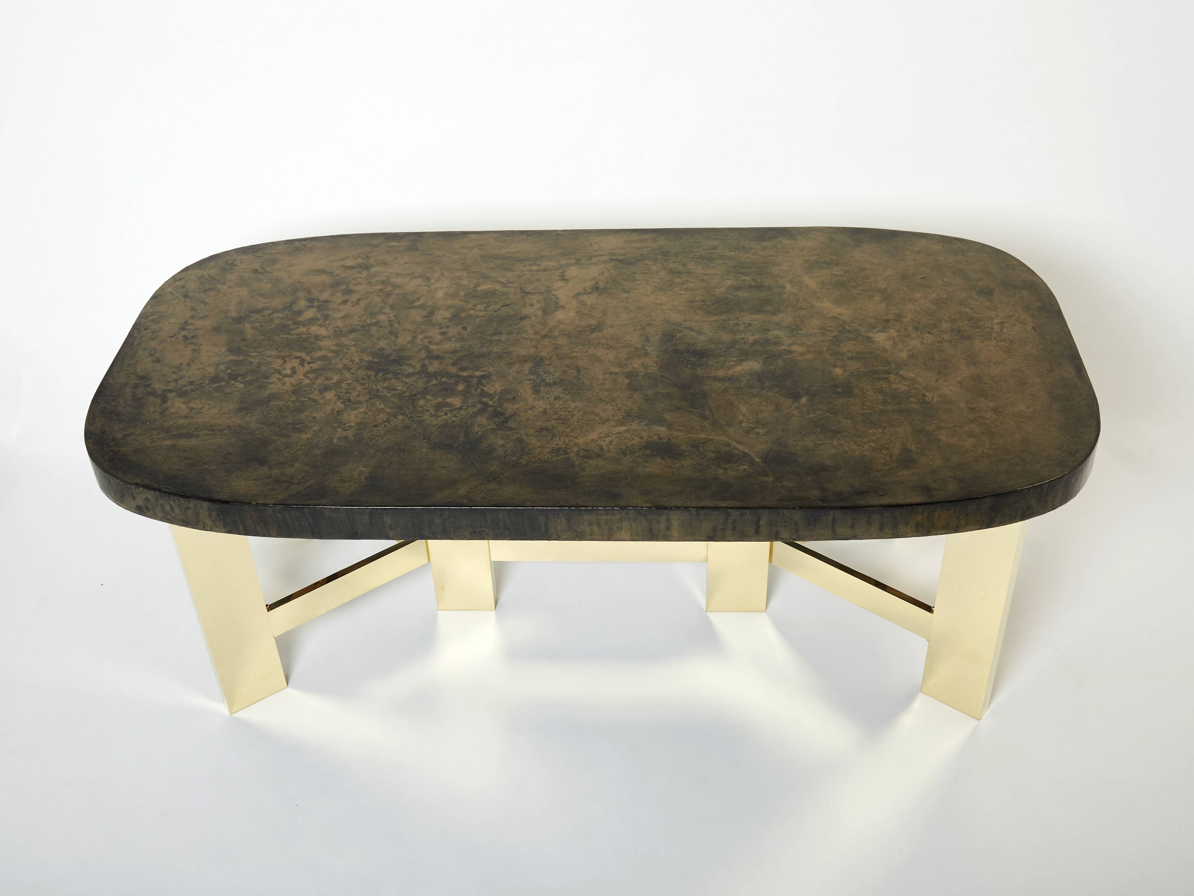 Brutalist Belgian dining table in resin and brass from around 1970.