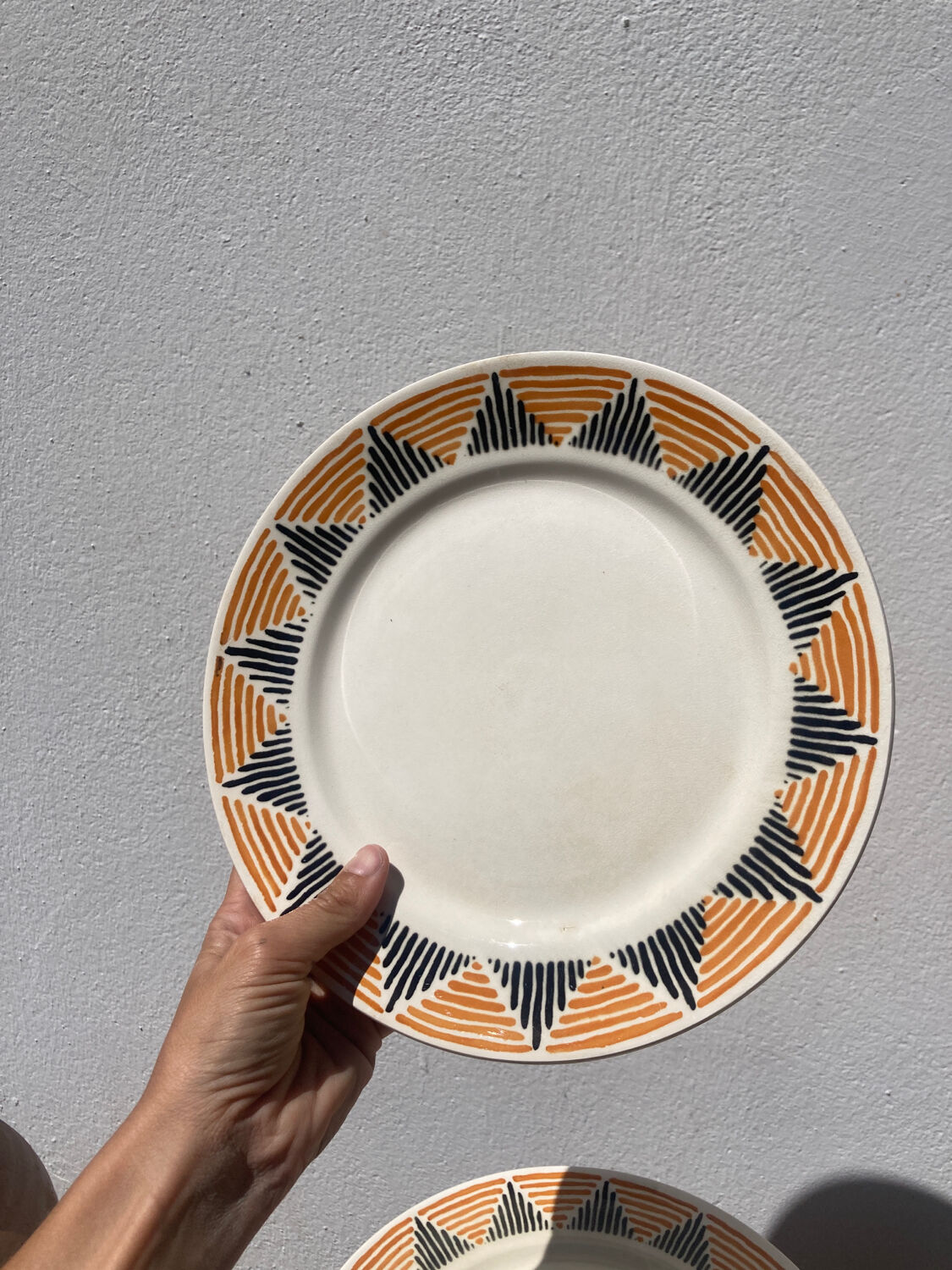 12 flat plates in yellow earthenware Badonviller