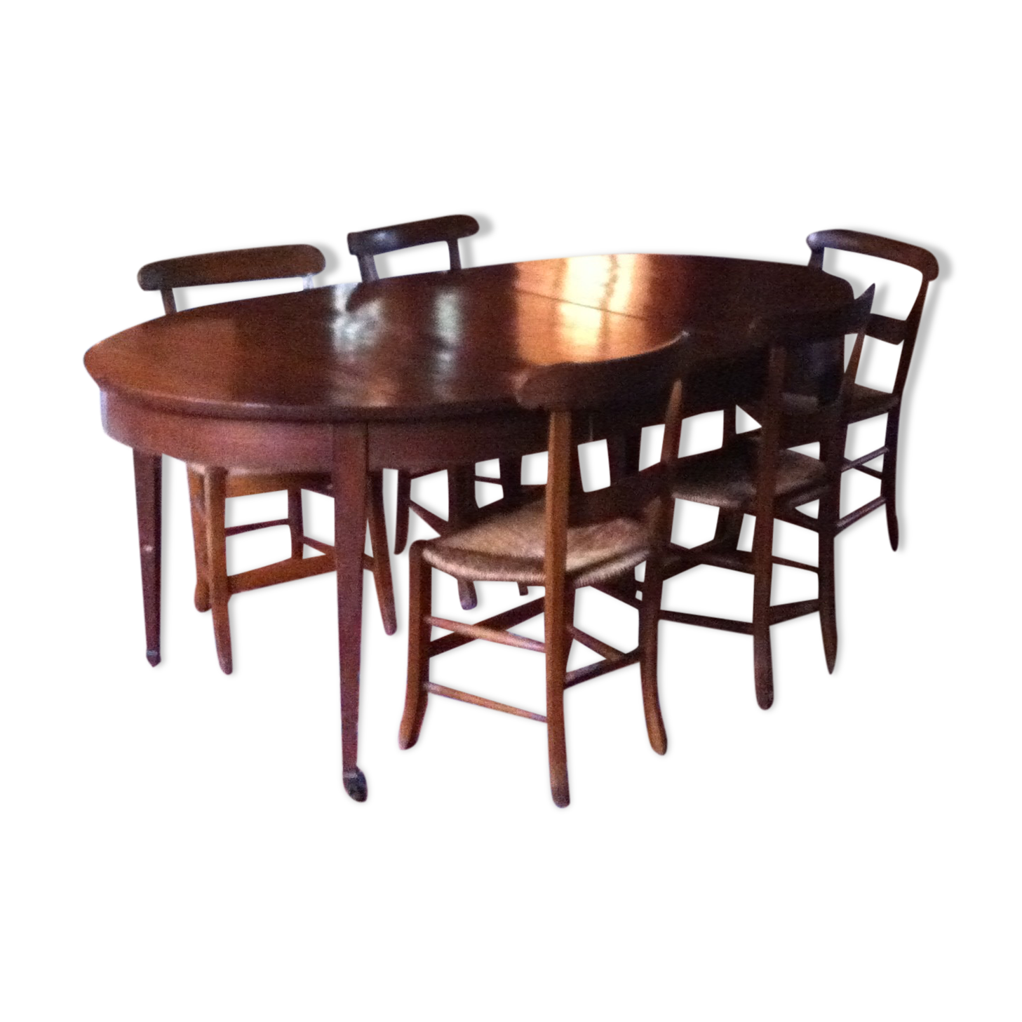 Solid oak table with 3 extension cords, 6 oak chairs with straw seat
